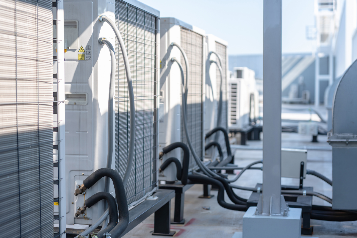 Multiple air cooling units are installed on the roof of the building. Each unit is connected to multiple indoor cooling units, to provide variable temperature control across the site.