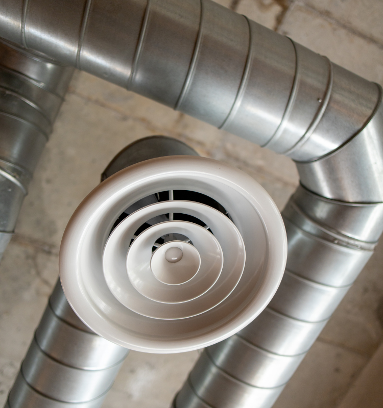 An industrial air cooling solution built into the metal ceiling ducts.