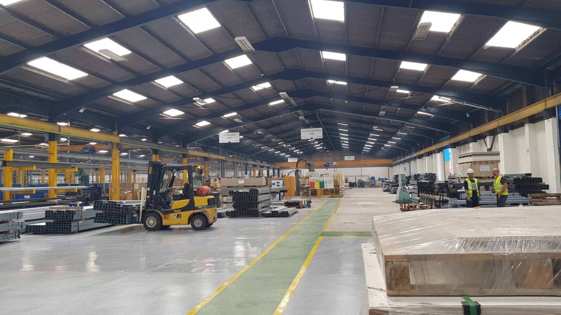 Inside a large, single-storey factory.